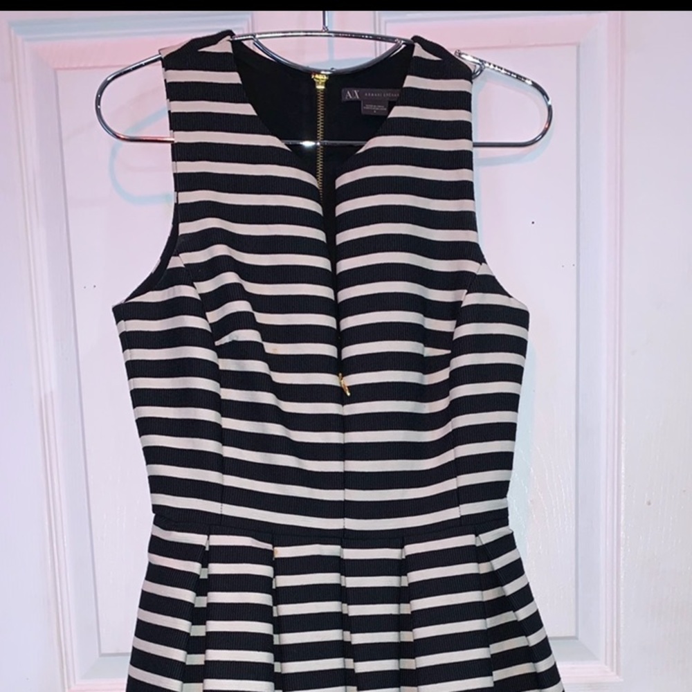 A striped navy blue and white dress with ruffles